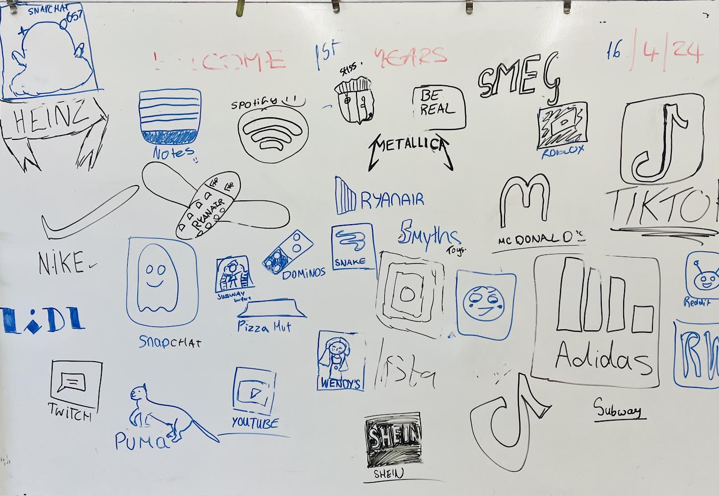 Logo design example drawn by the Art students on the whiteboard